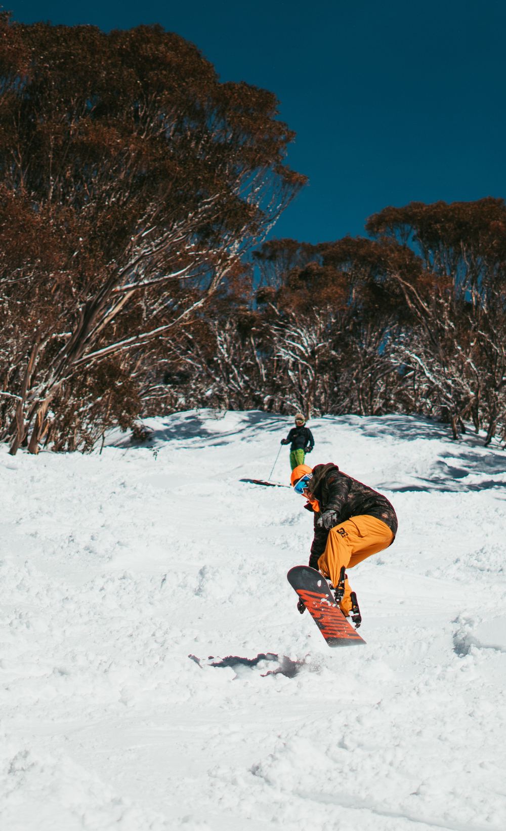 is skiing or snowboarding easier